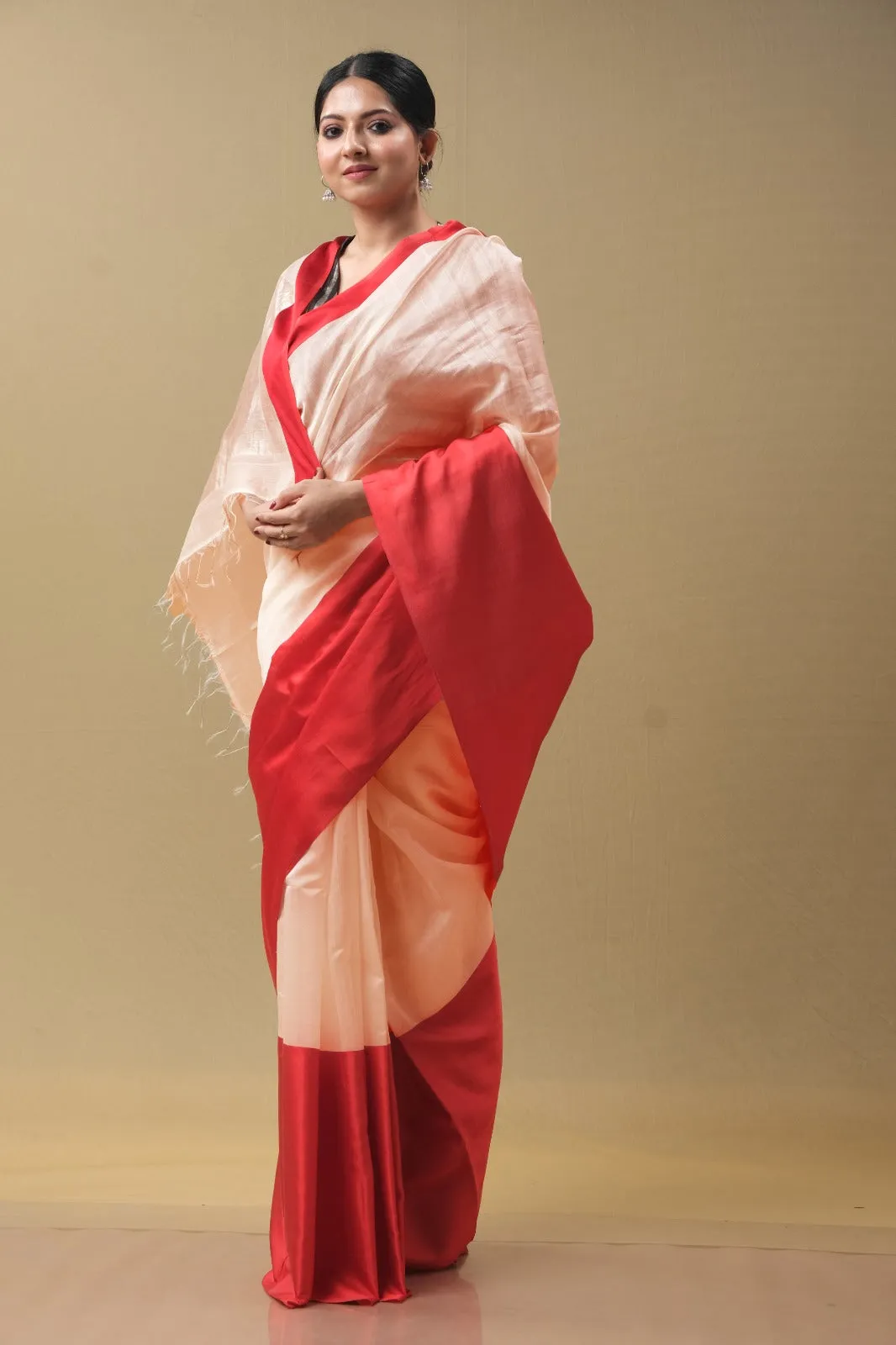 Peach and red sari with red blouse.