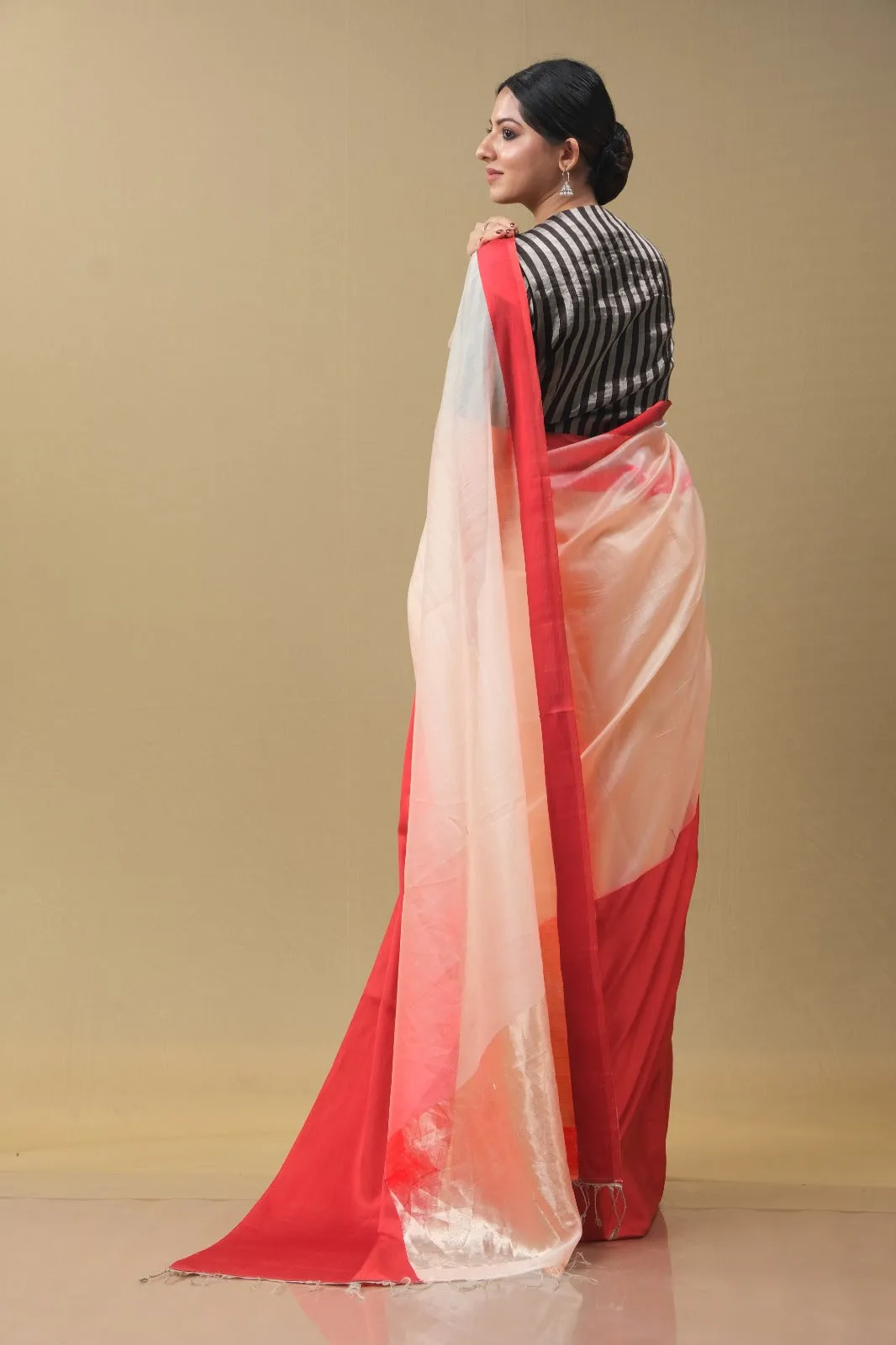 Peach and red sari with red blouse.